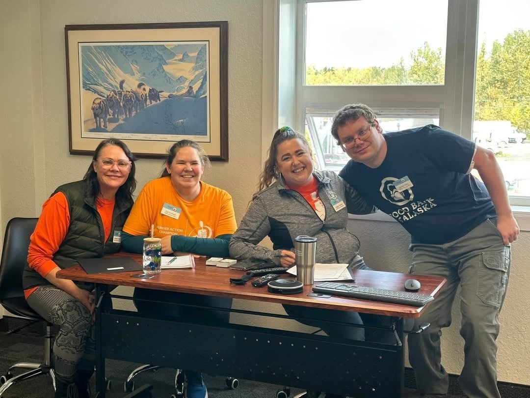 SNAP Outreach Team wearing orange for Hunger Action Month