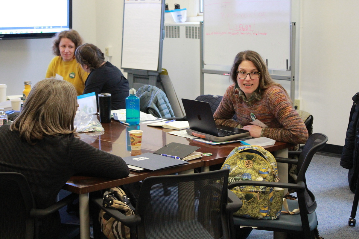 Alaska Food Coalition members discuss talking points and share stories in preparation for meetings with legislators.