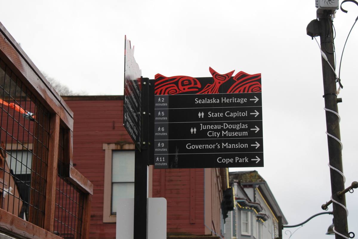 The Alaska State Capitol building sits in the heart of downtown Juneau, with towering mountains and a view of the Gastineau Channel.